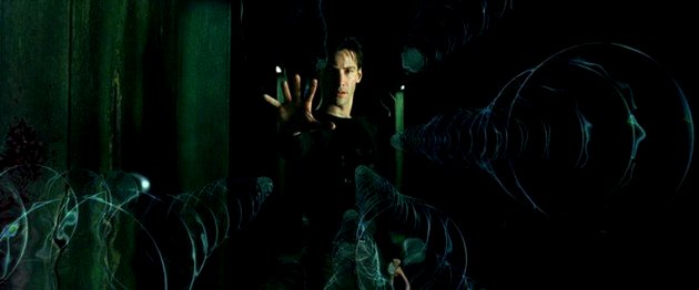 Neo deteniendo las balas.